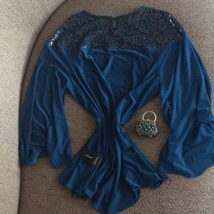 Luxury turquoise color blouse size large.